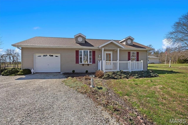 10 Mallard Dr, Carlyle, IL 62231 - ranch-style home with a porch, an attached garage, driveway, and a front yard