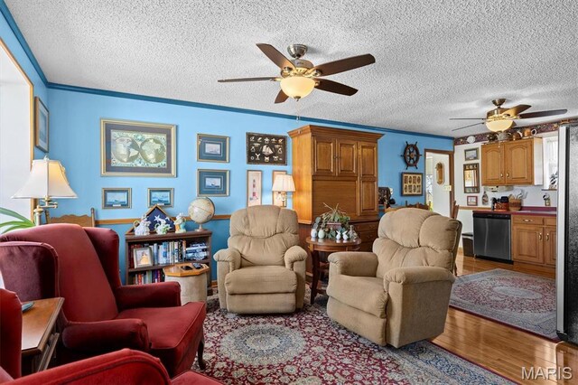 10 Mallard Dr, Carlyle, IL 62231 - living room with ceiling fan, wood finished floors, a textured ceiling, and ornamental molding