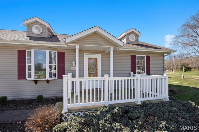 10 Mallard Dr, Carlyle, IL 62231 - view of front of property featuring a shingled roof and covered porch
