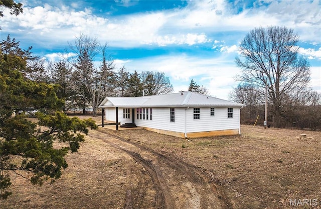 12000 State Rte E, Rolla, MO 65401 - rear view of property with a metal roof and a patio area