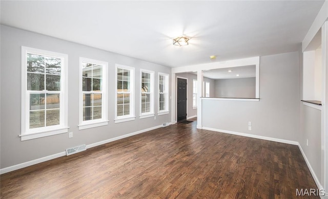 12000 State Rte E, Rolla, MO 65401 - unfurnished living room with dark wood finished floors and healthy amount of natural light