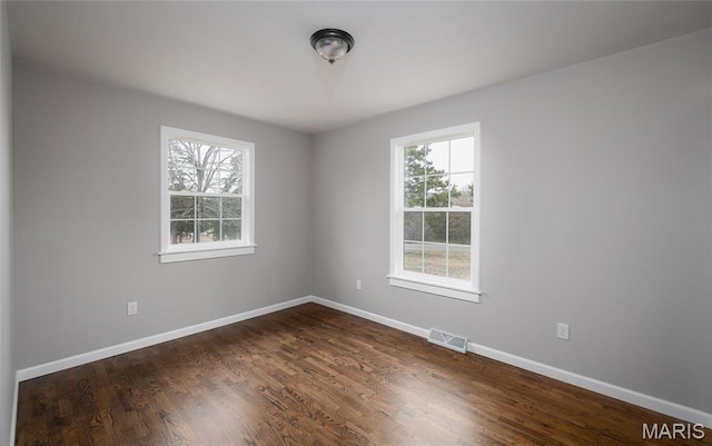 12000 State Rte E, Rolla, MO 65401 - spare room with healthy amount of natural light and dark wood-style flooring