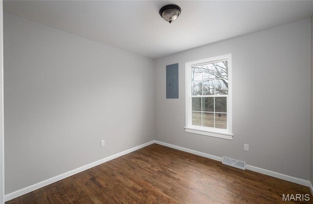 12000 State Rte E, Rolla, MO 65401 - unfurnished room featuring dark wood-type flooring and electric panel