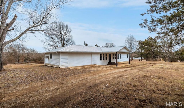 12000 State Rte E, Rolla, MO 65401 - rear view of property with a metal roof and driveway