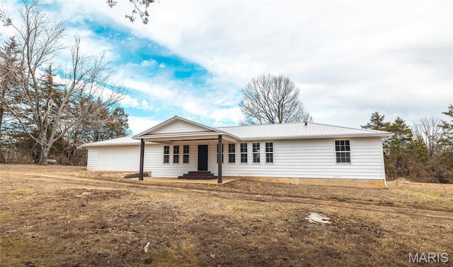 12000 State Rte E, Rolla, MO 65401 - single story home featuring a metal roof, a garage, and covered porch