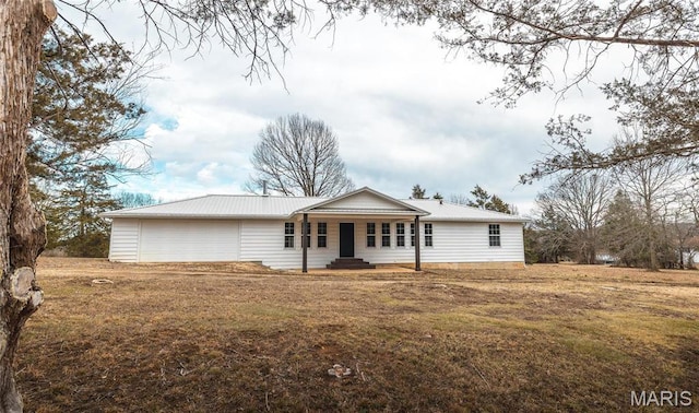 12000 State Rte E, Rolla, MO 65401 - ranch-style house with a porch, a front lawn, a metal roof, and a garage