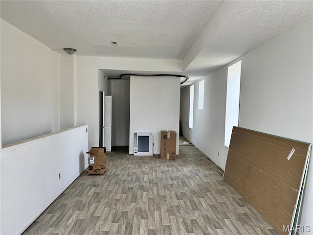 1519 Mallinckrodt St, Saint Louis, MO 63107 - empty room featuring wood finished floors and a textured ceiling