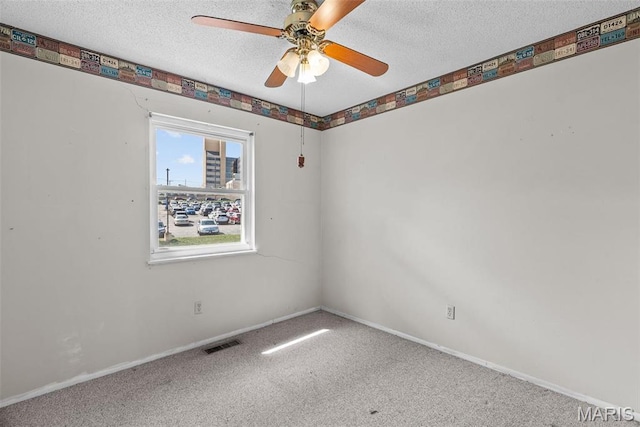 953 E 1st St, Washington, MO 63090 - empty room with a ceiling fan, a textured ceiling, carpet floors, and baseboards