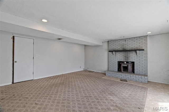 953 E 1st St, Washington, MO 63090 - unfurnished living room with baseboards, recessed lighting, and a textured ceiling