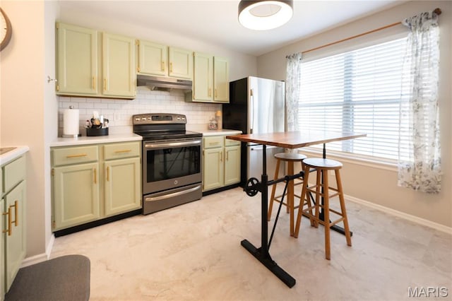 749 Sugar Glen Dr Unit 8, Saint Peters, MO 63376 - kitchen featuring appliances with stainless steel finishes, green cabinets, under cabinet range hood, and tasteful backsplash