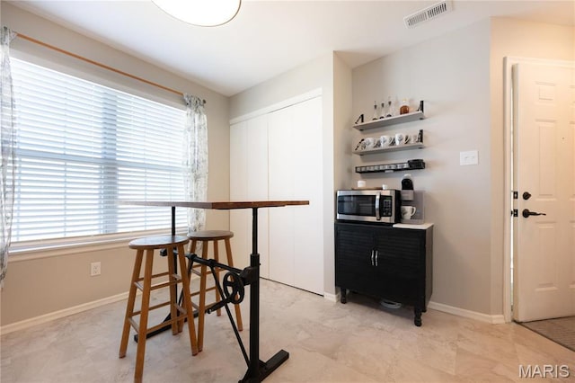 749 Sugar Glen Dr Unit 8, Saint Peters, MO 63376 - dining space with baseboards