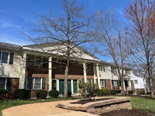 1767 High School Dr, Brentwood, MO 63144 - greek revival inspired property featuring brick siding