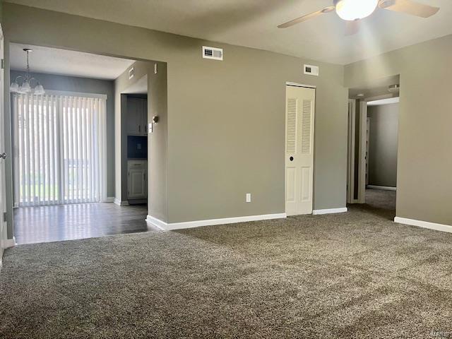 1767 High School Dr, Brentwood, MO 63144 - empty room with carpet, a ceiling fan, baseboards, and a chandelier