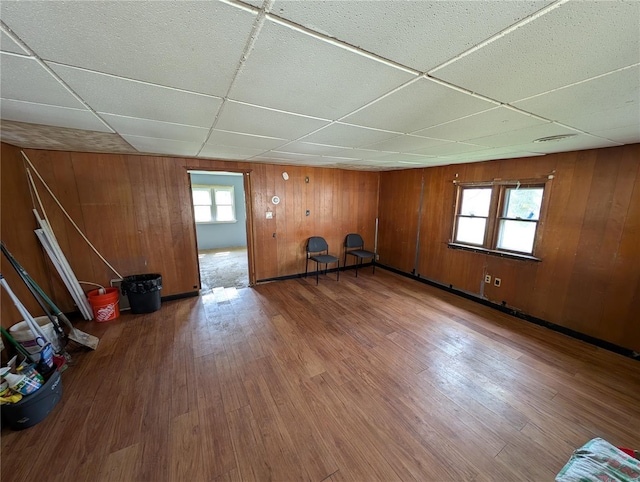 1300 Rixon, Alton, IL 62002 - below grade area with a drop ceiling, wood finished floors, and wooden walls
