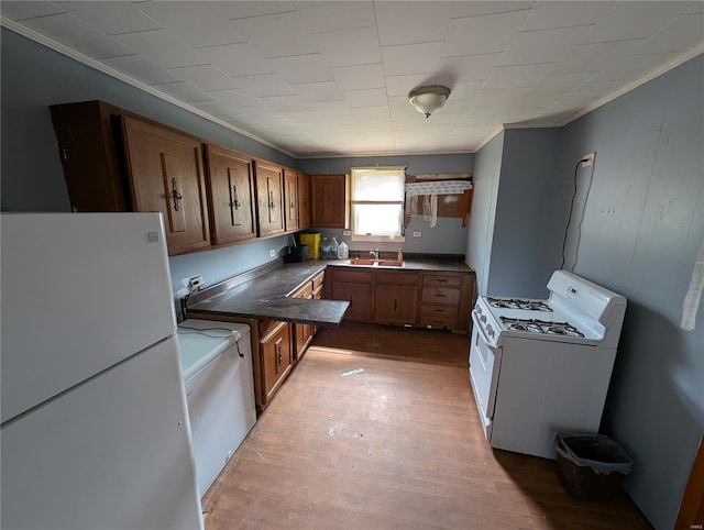 1300 Rixon, Alton, IL 62002 - kitchen featuring white appliances, a sink, ornamental molding, brown cabinets, and light wood-style flooring