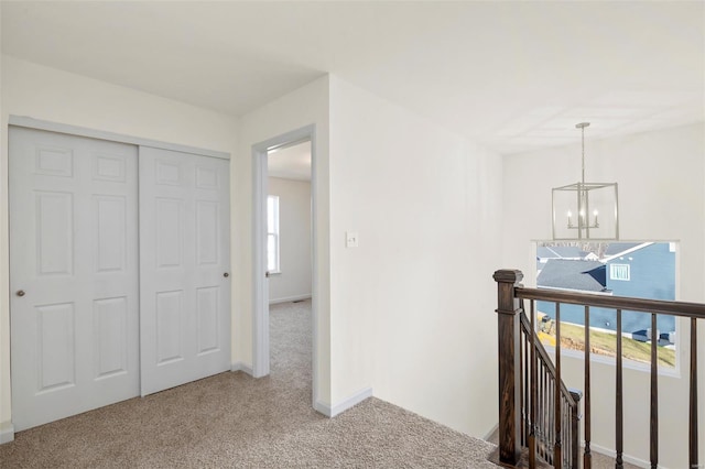 2414 Chukka Dr, Eureka, MO 63025 - corridor featuring an upstairs landing, a chandelier, carpet, and baseboards