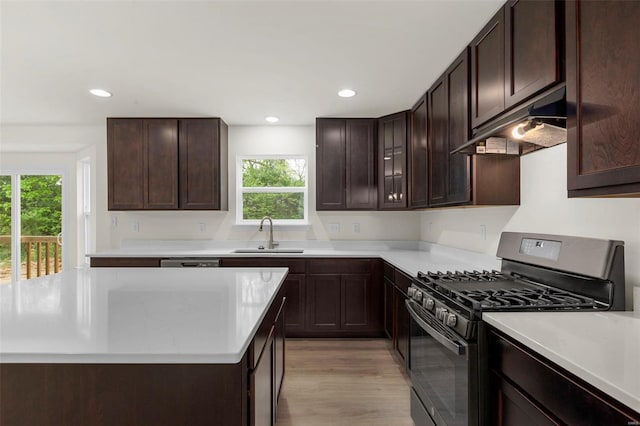 2414 Chukka Dr, Eureka, MO 63025 - kitchen with gas stove, under cabinet range hood, a sink, plenty of natural light, and recessed lighting