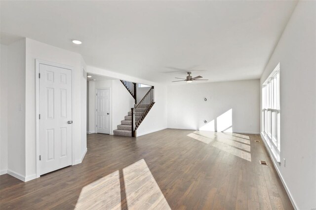 2414 Chukka Dr, Eureka, MO 63025 - unfurnished living room featuring a ceiling fan, wood finished floors, stairs, baseboards, and recessed lighting