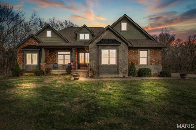 412 Big River Cir, Bonne Terre, MO 63628 - craftsman-style home with a front yard, stone siding, covered porch, and a shingled roof