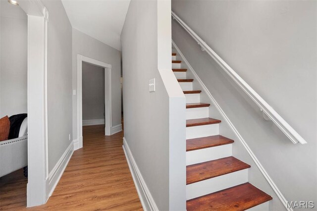 4525 Oakland Ave, Saint Louis, MO 63110 - staircase featuring wood finished floors and baseboards
