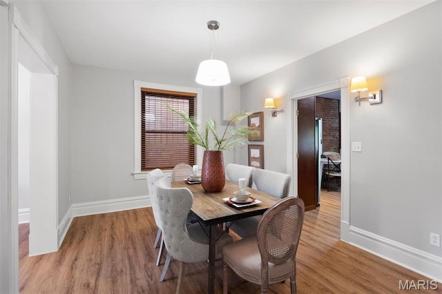 4525 Oakland Ave, Saint Louis, MO 63110 - dining area with wood finished floors and baseboards
