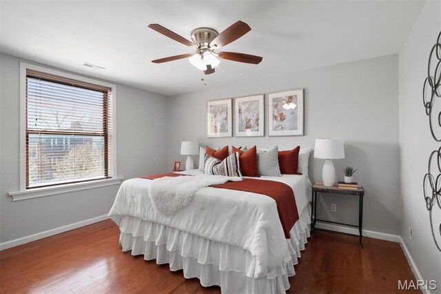 4525 Oakland Ave, Saint Louis, MO 63110 - bedroom with wood finished floors, baseboards, and ceiling fan