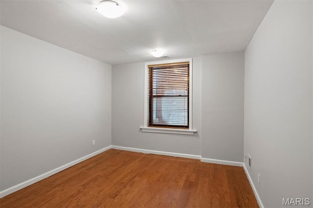 4525 Oakland Ave, Saint Louis, MO 63110 - unfurnished room featuring wood finished floors and baseboards