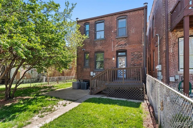 4525 Oakland Ave, Saint Louis, MO 63110 - rear view of property with brick siding and central air condition unit