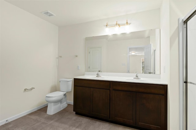 16787 River Stone Dr, Florissant, MO 63031 - full bath featuring toilet, double vanity, and baseboards