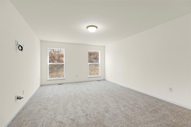 16787 River Stone Dr, Florissant, MO 63031 - spare room with carpet floors and baseboards