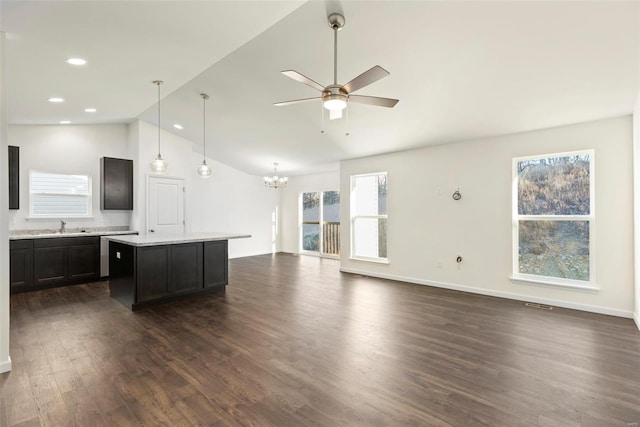 16787 River Stone Dr, Florissant, MO 63031 - kitchen with lofted ceiling, ceiling fan, dark wood-style floors, a center island, and a chandelier