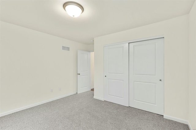 16787 River Stone Dr, Florissant, MO 63031 - unfurnished bedroom featuring light carpet, baseboards, and a closet