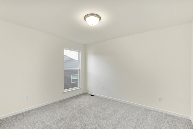 16787 River Stone Dr, Florissant, MO 63031 - spare room featuring carpet flooring and baseboards