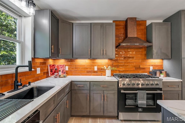 406 Meyer Ave, Saint Louis, MO 63122 - kitchen with high end stove, wall chimney exhaust hood, light stone counters, and decorative backsplash