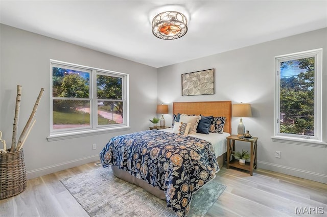406 Meyer Ave, Saint Louis, MO 63122 - bedroom featuring wood finished floors and baseboards