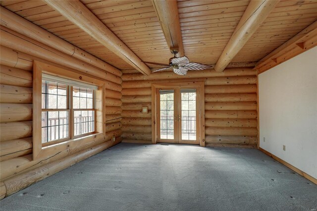 carpeted spare room with french doors, wooden ceiling, beam ceiling, rustic walls, and ceiling fan