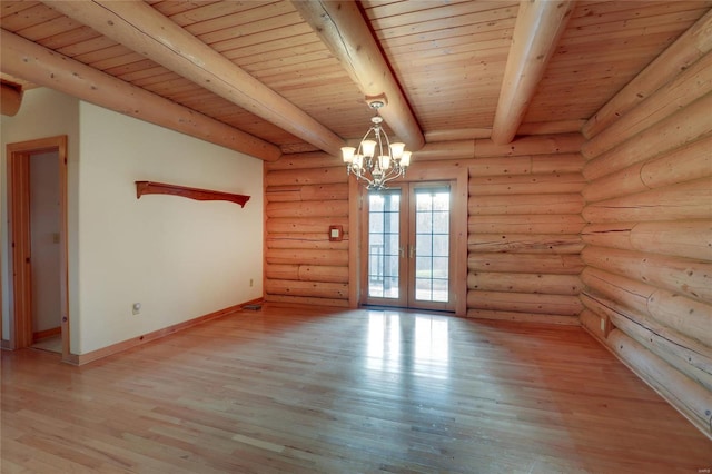 empty room with a chandelier, beam ceiling, wood ceiling, french doors, and light wood-type flooring