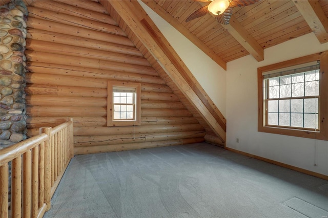 bonus room featuring beamed ceiling, rustic walls, carpet floors, wooden ceiling, and ceiling fan
