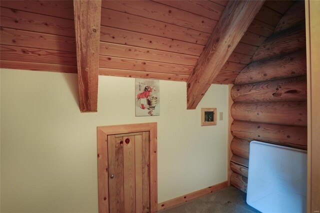 bonus room with carpet, beam ceiling, baseboards, and wood ceiling