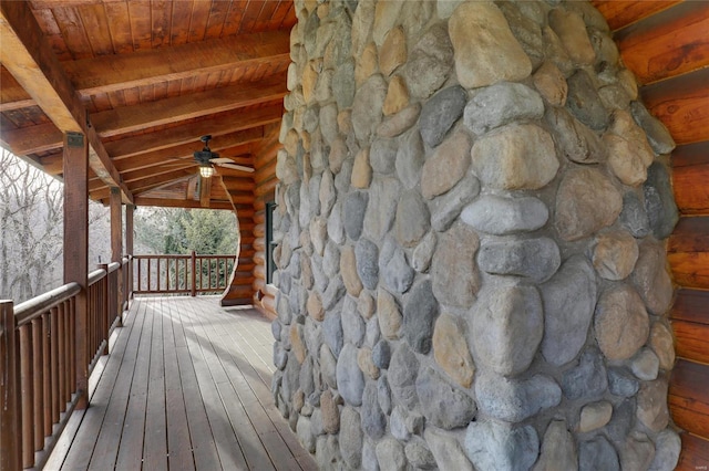 wooden terrace with a ceiling fan