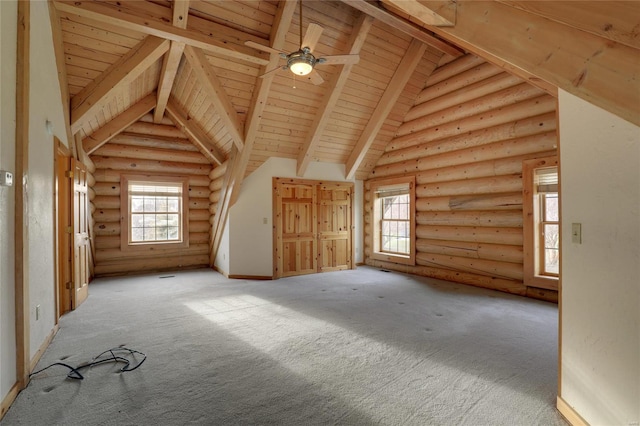 additional living space with wooden ceiling, beamed ceiling, rustic walls, carpet flooring, and high vaulted ceiling