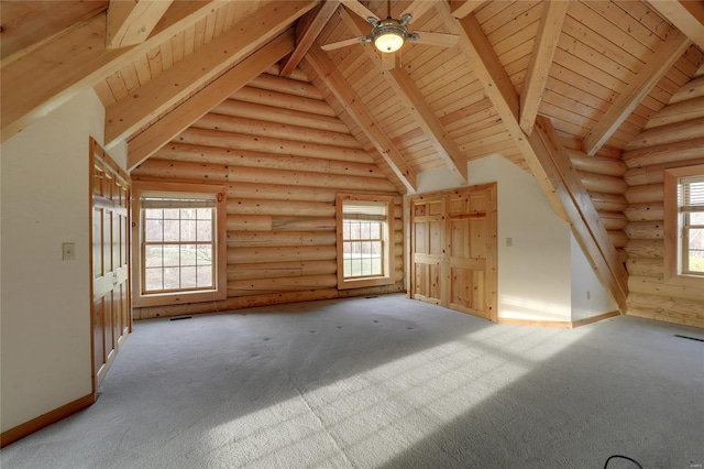 additional living space with beam ceiling, log walls, plenty of natural light, wooden ceiling, and a ceiling fan