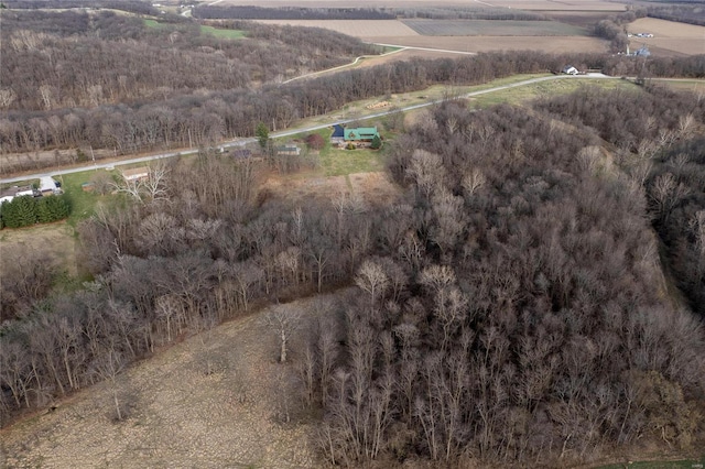 aerial view of property and surrounding area featuring rural landscape and abundant farmland