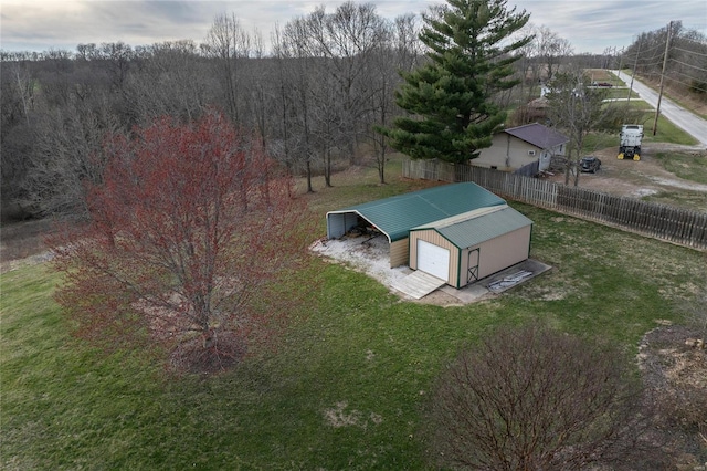 aerial view of property and surrounding area featuring a forest