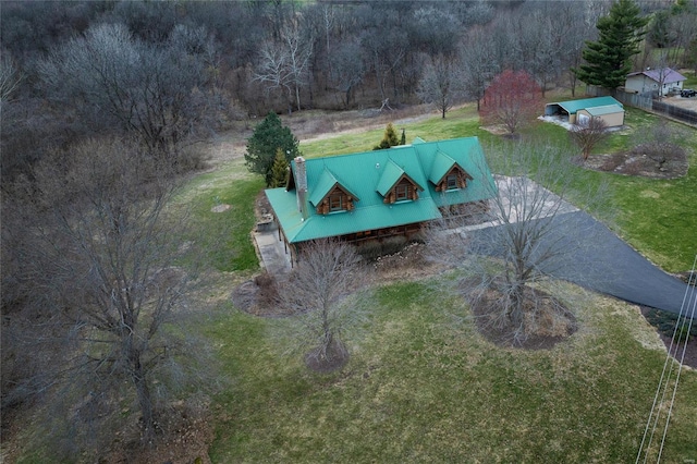 view from above of property featuring a heavily wooded area