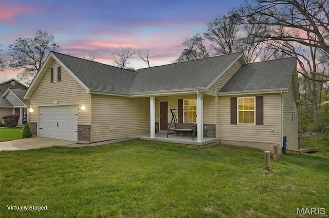 view of front of property with a yard, driveway, and roof with shingles