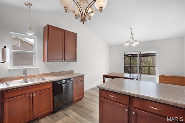 kitchen with dishwasher, a sink, a chandelier, light wood-type flooring, and vaulted ceiling