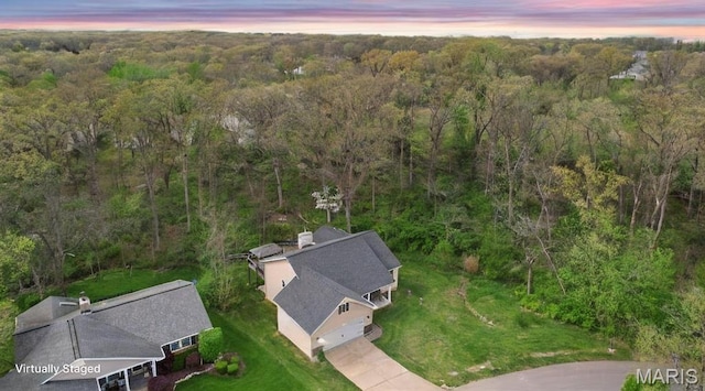 aerial view at dusk of a wooded view