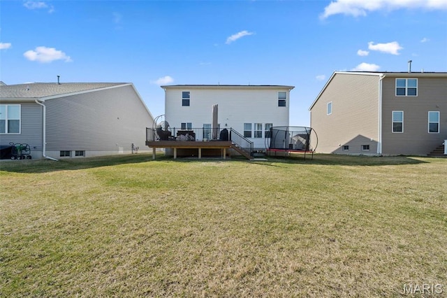 905 Sugar Pear St, Saint Charles, MO 63301 - rear view of house featuring a trampoline, stairway, a wooden deck, and a lawn