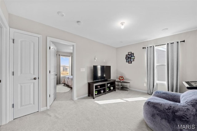 905 Sugar Pear St, Saint Charles, MO 63301 - carpeted living area featuring baseboards